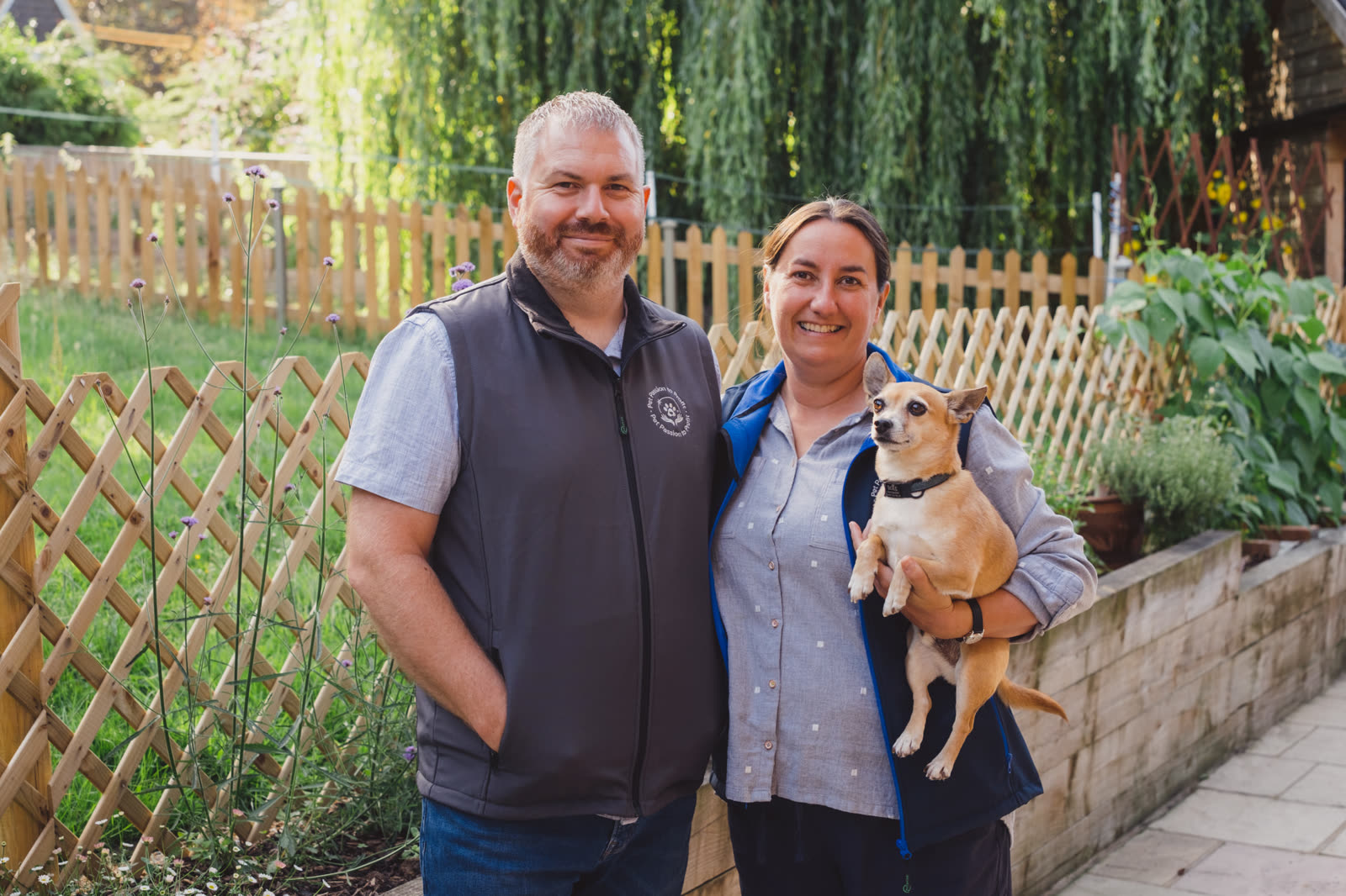 Bill and Emma from Pet Passion to Profit outdoors with their dog